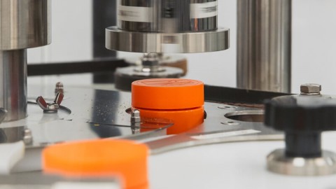 Container filling system capping bottle