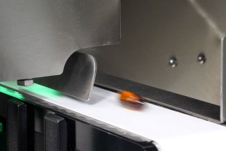 gummy passing through check weighing system with emfr